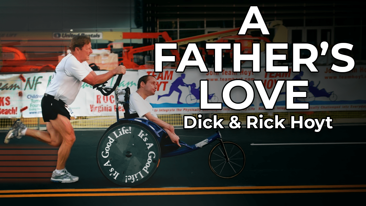 A father who is pushing his paralytic son on an ironman challenge